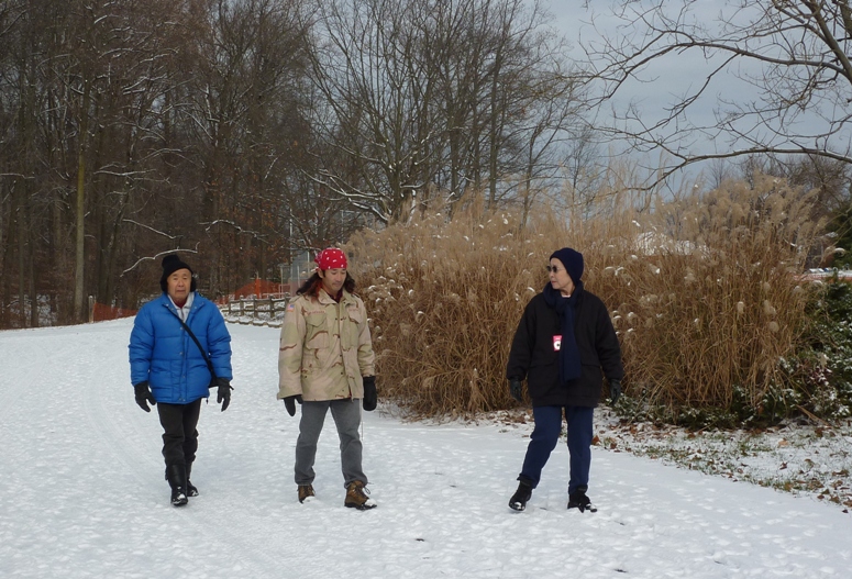 Dad, Mom, and I walking on snow