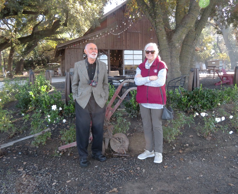 Drs. Dennis and Sharon in front of restored heritage barn