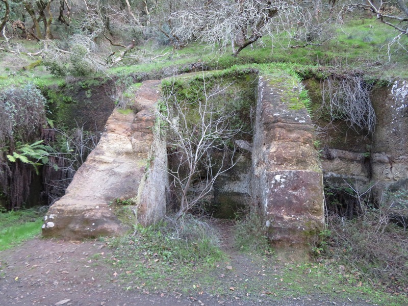 Stone or mortar ruins built into the side of a hill