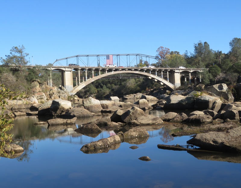 Lake Natoma Crossing Bridge with American flag hanging from it