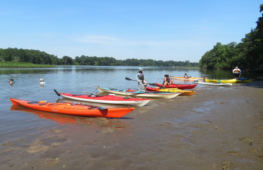 Several kayaks on the beach