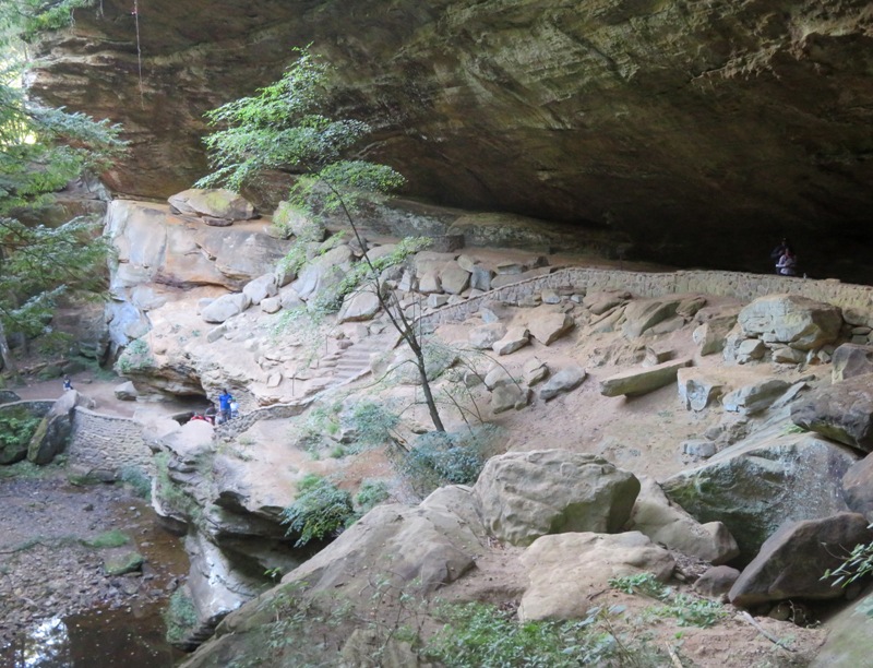 Stairs leading to cave in cliff