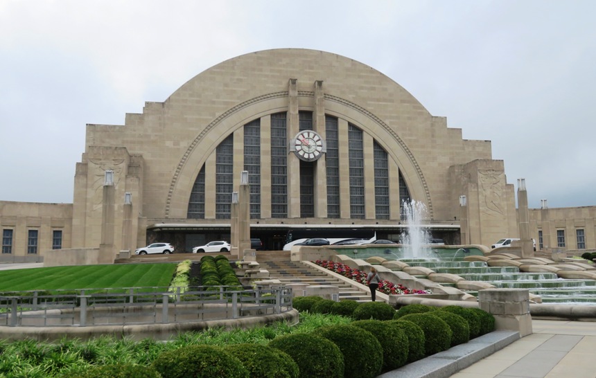 Norma walking up steps on front of museum