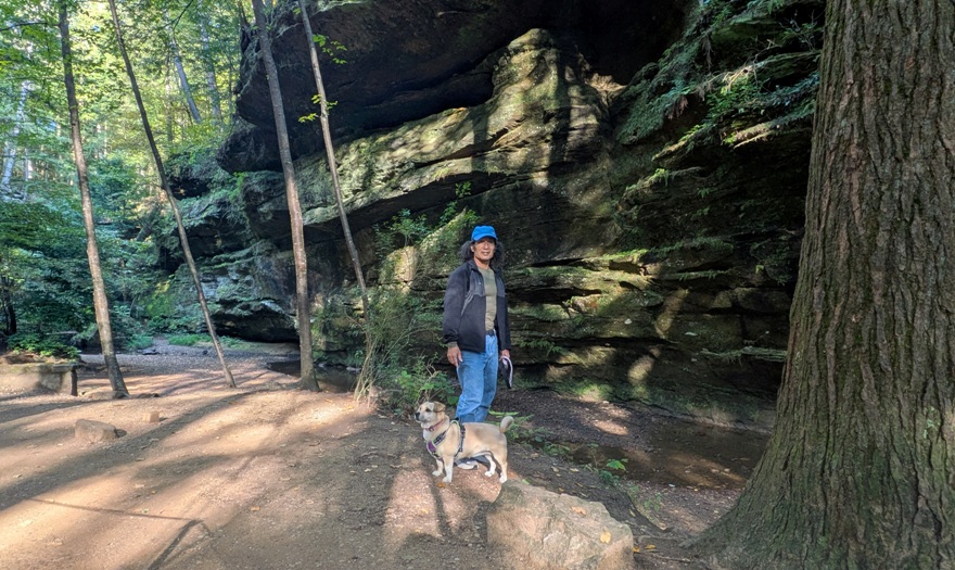 Daphne and I with rock wall behind