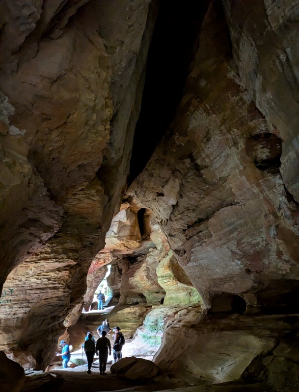 View of people standing inside the cave