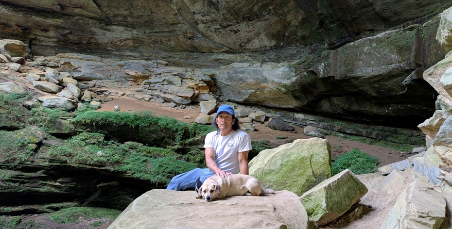Daphne and I on a rock, looking tired with the cliffs behind