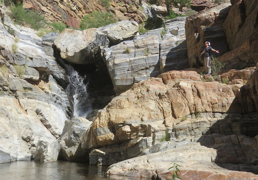 Norma standing with arms outstretched