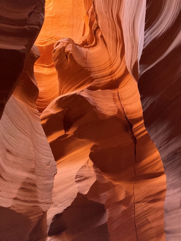 Rocks in the slot canyon glowing deep orange