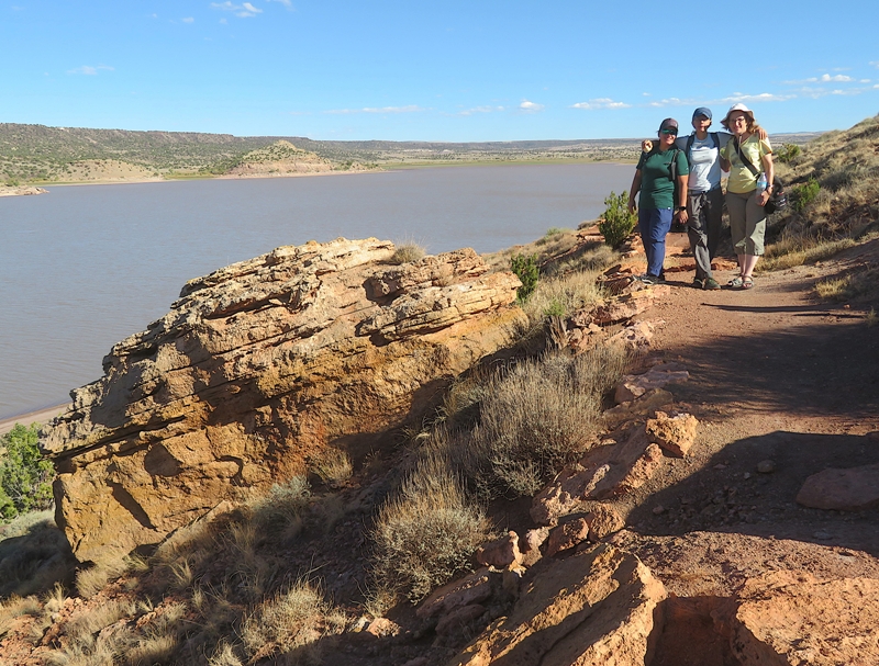 Robin, Carmen, and Norma with the lake behind