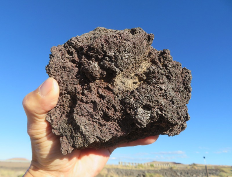 Me holding volcanic rock