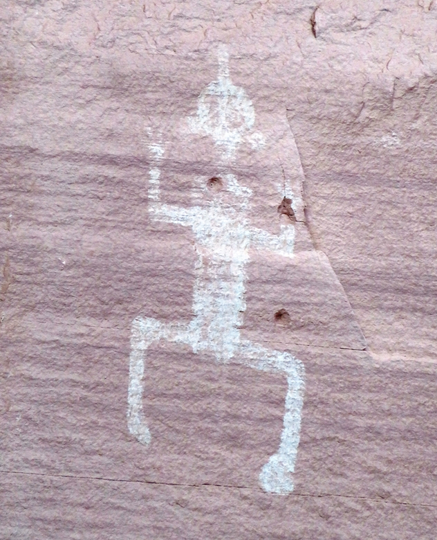 Man with raised hands and hat...at least that's my opinion