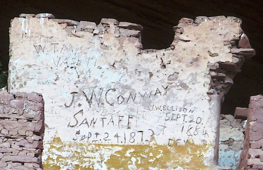 Written inscriptions on white wall