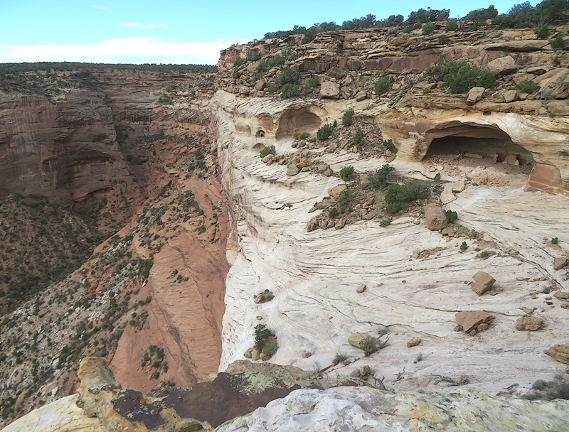 Cliff with structures inside a shallow cave