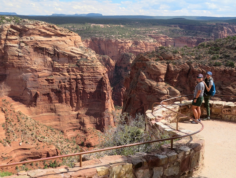 Robin and Carmen standing behind railing at overlook