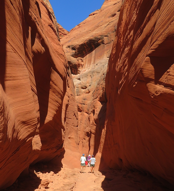 Carmen and Robin walking through a narrow part of the canyon