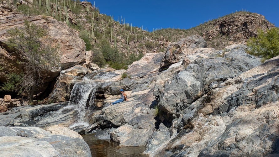Me seated next to the falls