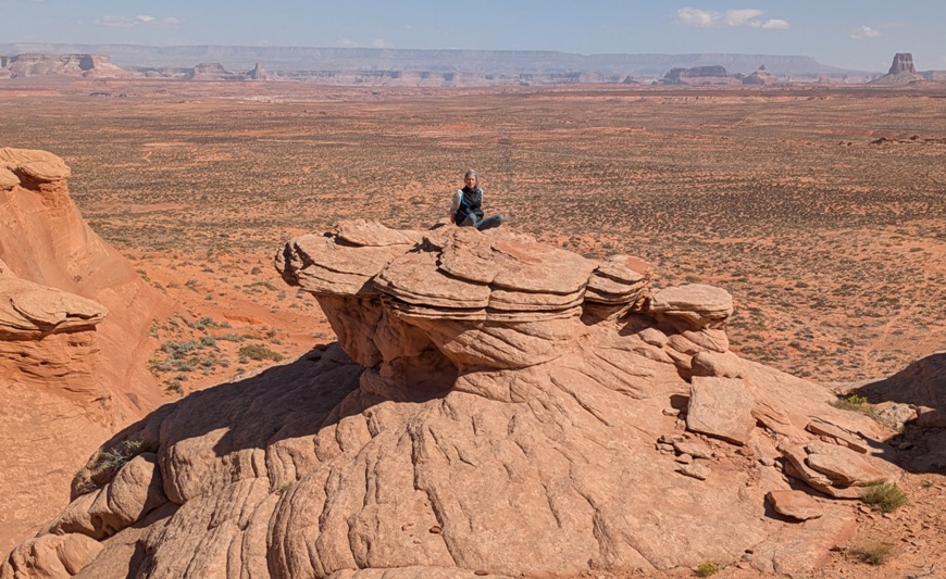 Carmen sitting on rocky high point