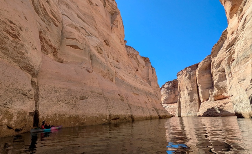 Zack playing flute from kayak