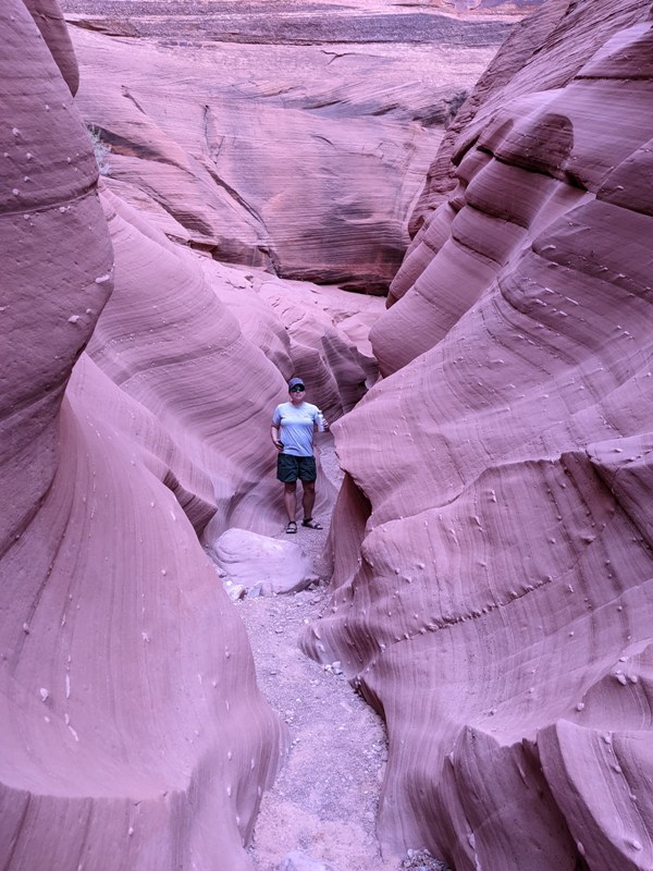 Robin walking in narrow section of canyon