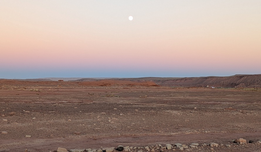 Almost full moon rising over the desert