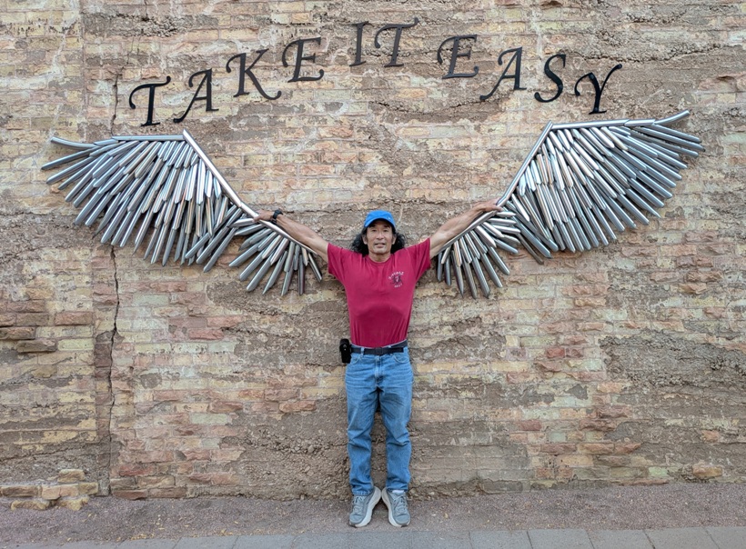 Me between outstretched metal wings