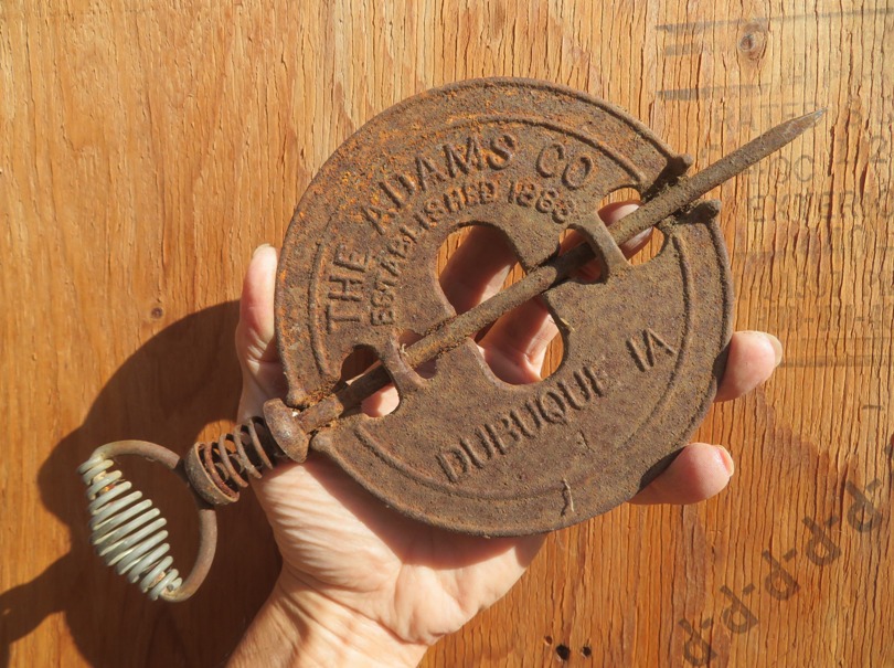 Me holding rusty stove pipe damper