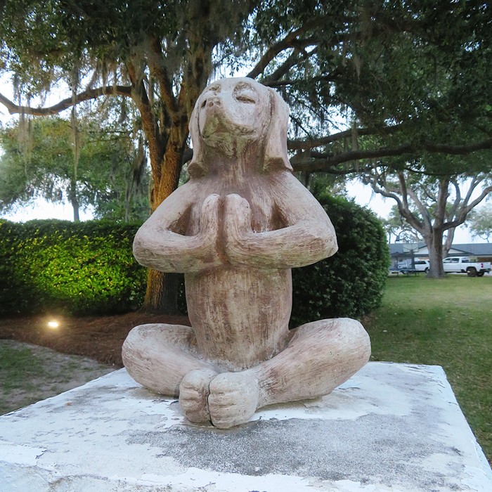 Statue of dog meditating