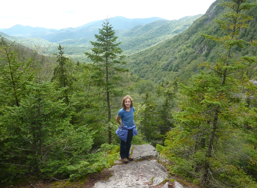 Norma standing on rock with scenic view behind