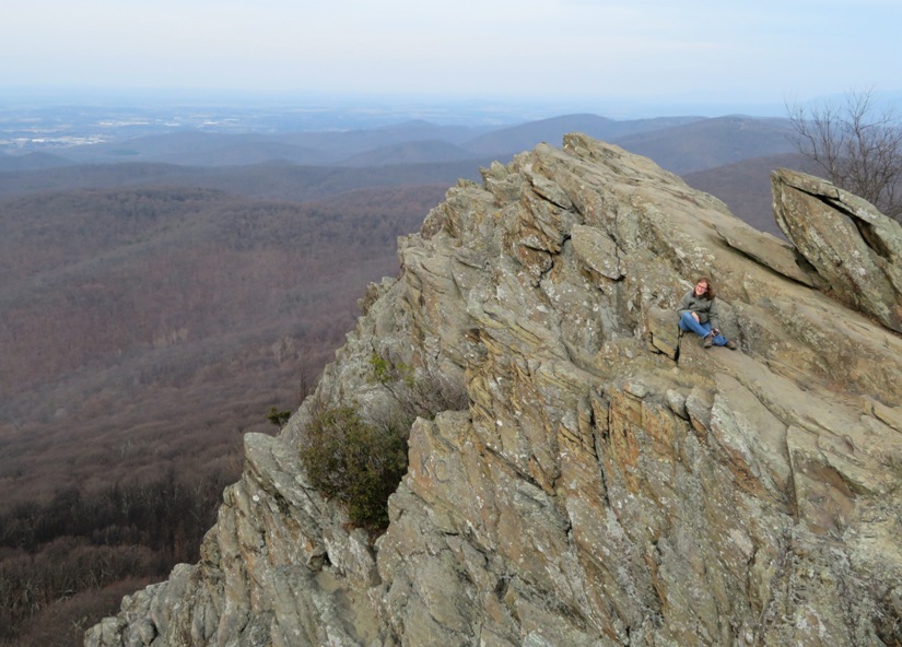 Norma sitting at the edge of Humpback Rocks