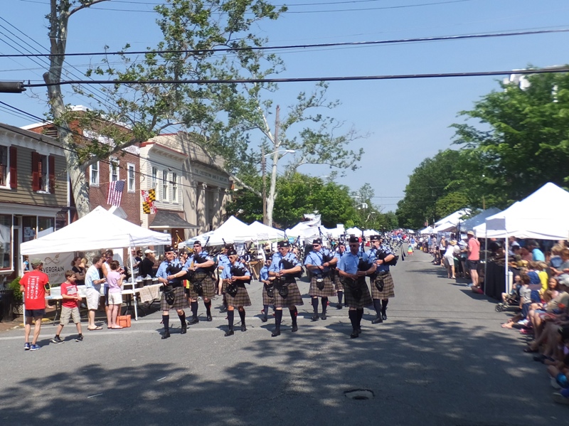 Bagpipe players marching down High Street
