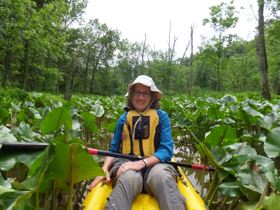 Norma in kayak amongst the spatterdock