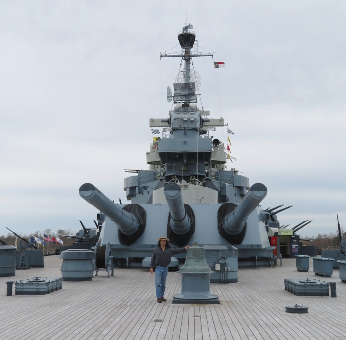 Me standing on a battleship in front of the 16-inch guns
