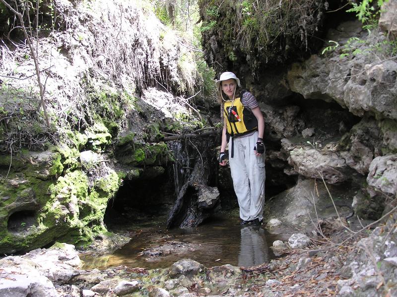 Norma standing next to small spring