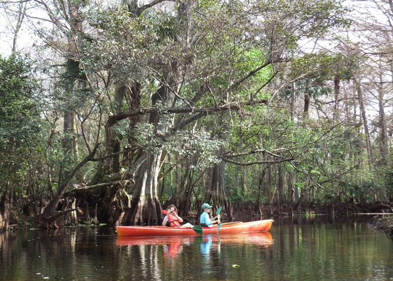Norma in the kayak with Carmen, taking a picture of me