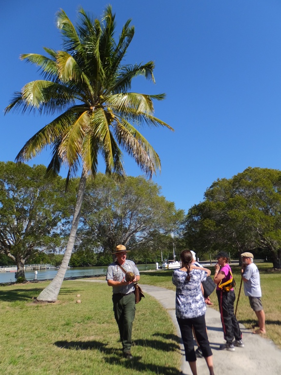 Ranger Dan holding coconut and speaking to group