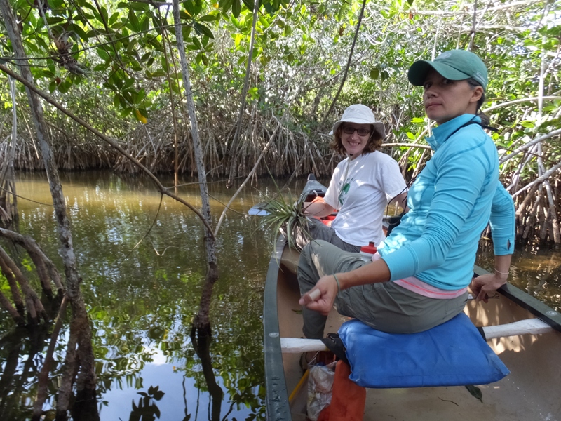 Norma and Carmen in canoe, surrounded by mangroves