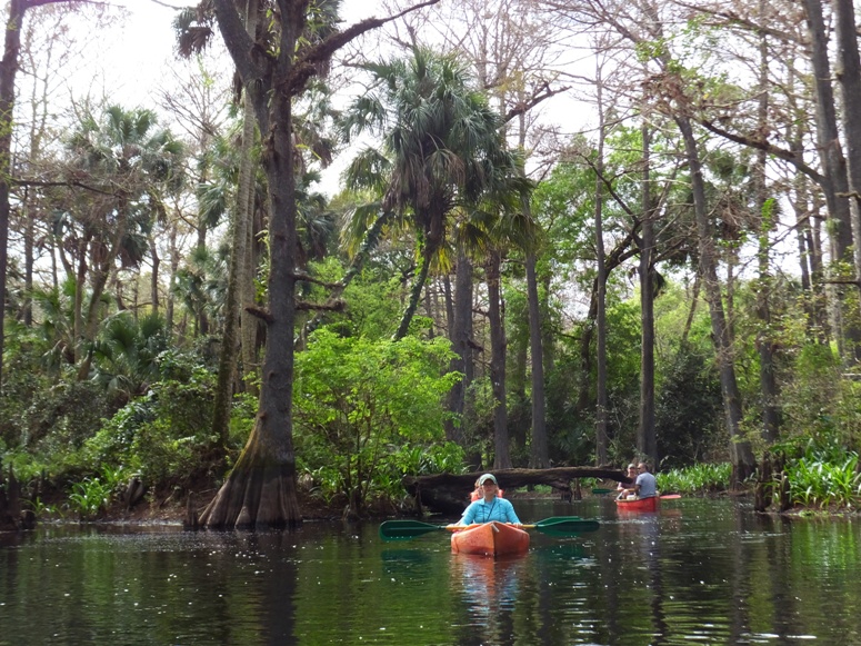 Norma and Carmen in kayak with other kayakers behind