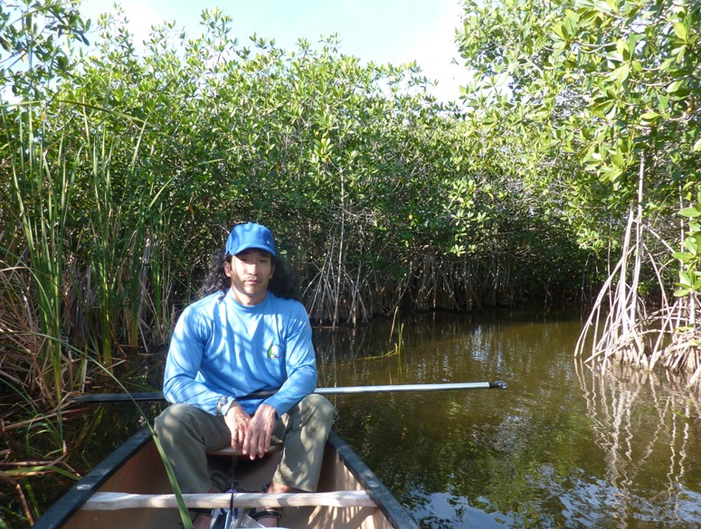 Me in the canoe with mangroves behind