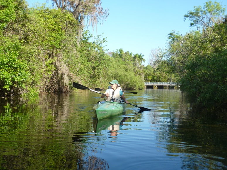 Carmen kayaking with Norma behind