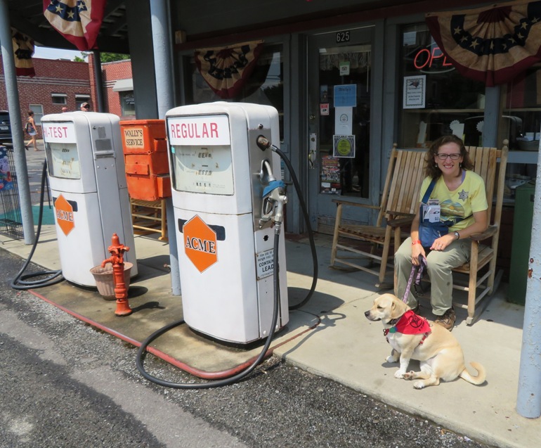Norma sitting in chair with Daphne at the service station
