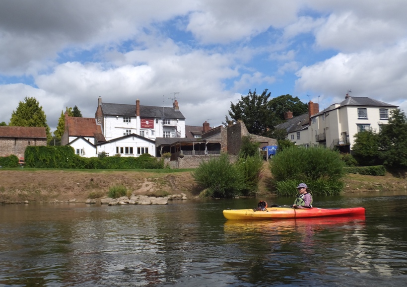 Sara in her kayak with the White Lion behind