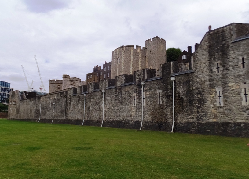 Solid castle walls with narrow window openings to shoot out