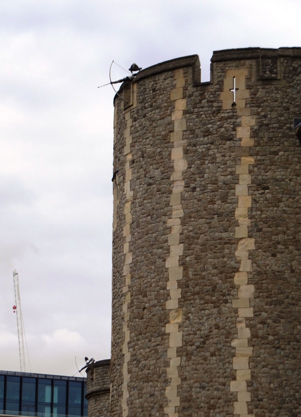 Castle towers with archer figures at the top