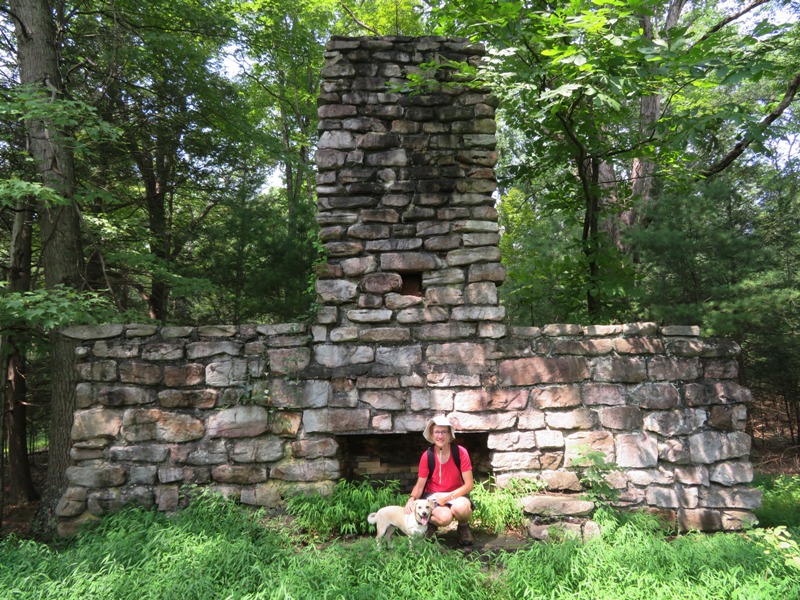 Norma and Daphne in front of stone ruins of house