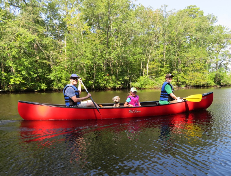 Mark, Allison, their daughter, and April in their canoe