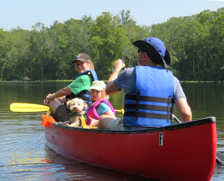 Allison, April, daughter, and Mark in their canoe