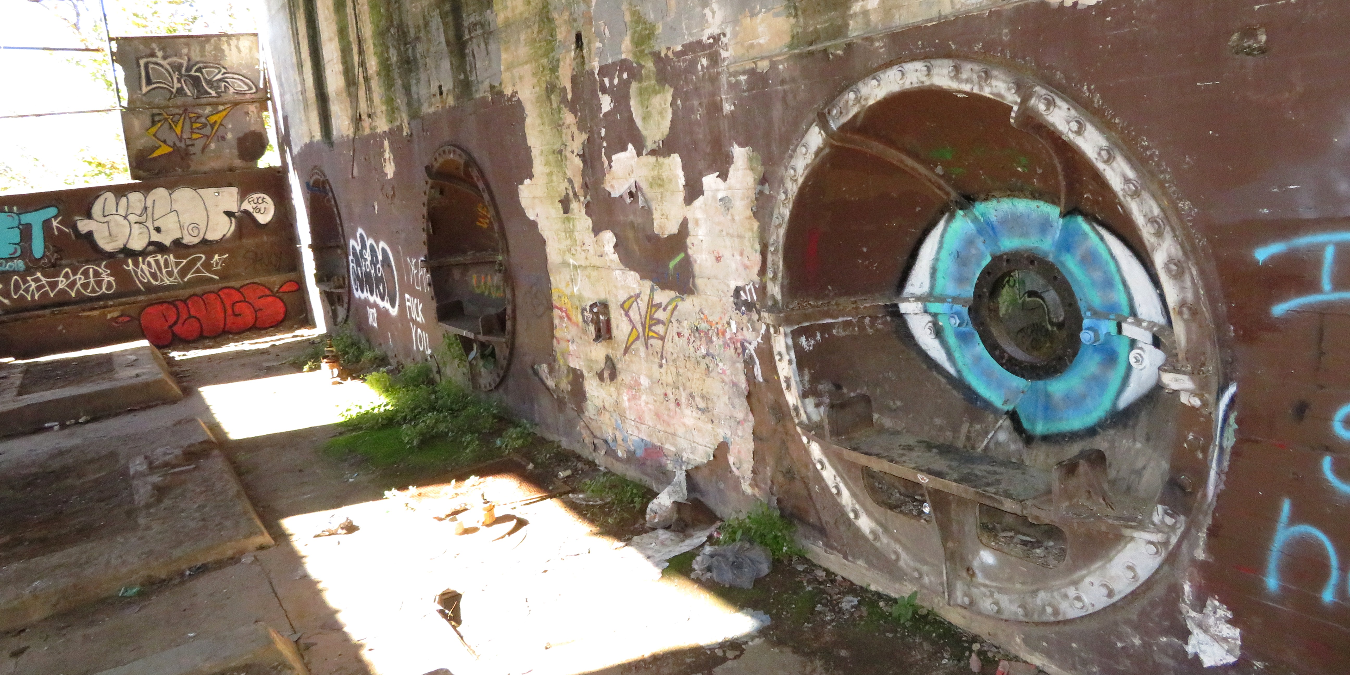 Ruins of hydroelectric building at Belle Isle; maybe water once flowed through these big round, covered openings