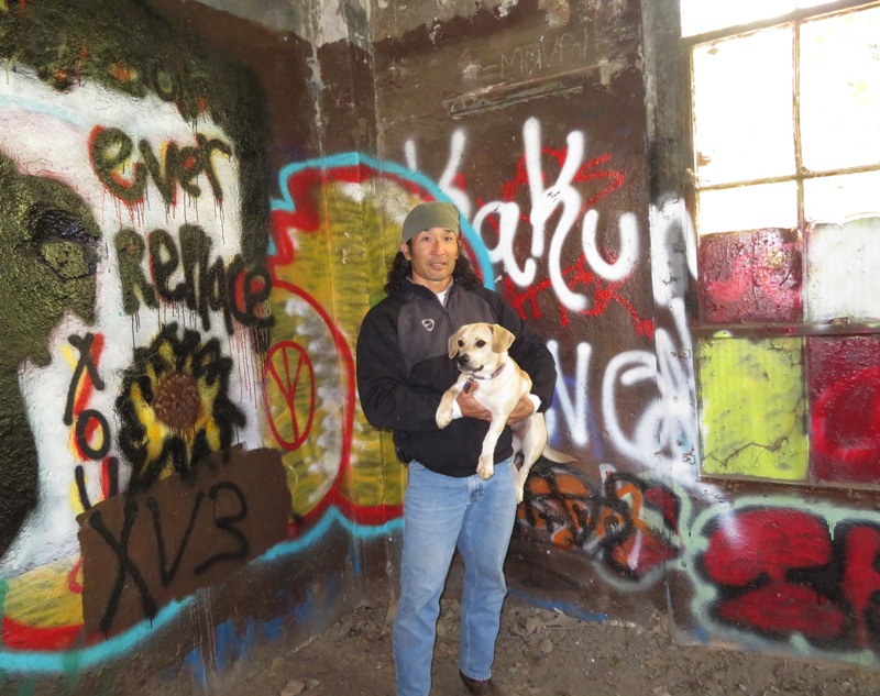 Daphne and me inside the building with graffiti on the walls