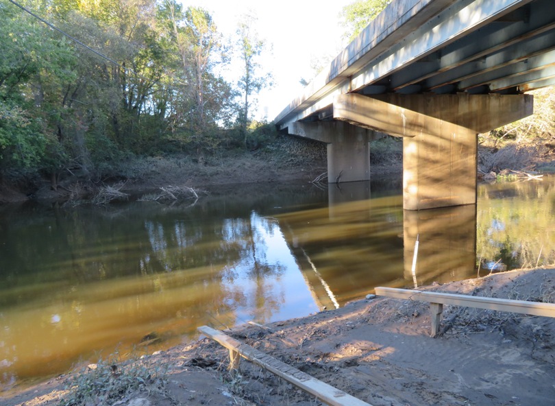 Muddy launch site by bridge