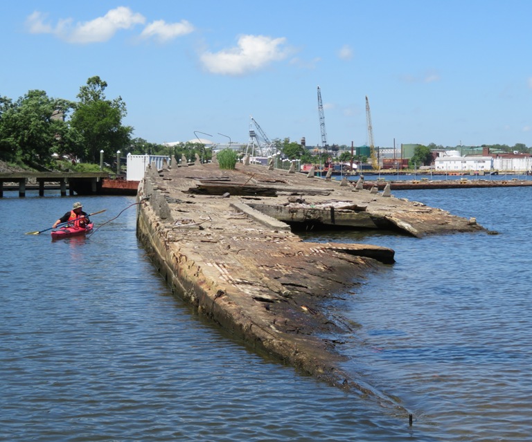 Steve kayaking by a concrete ship